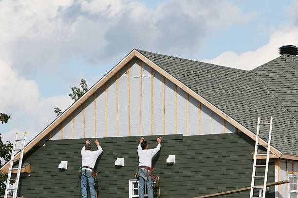 Professional Siding technician working in Dunlevy, PA